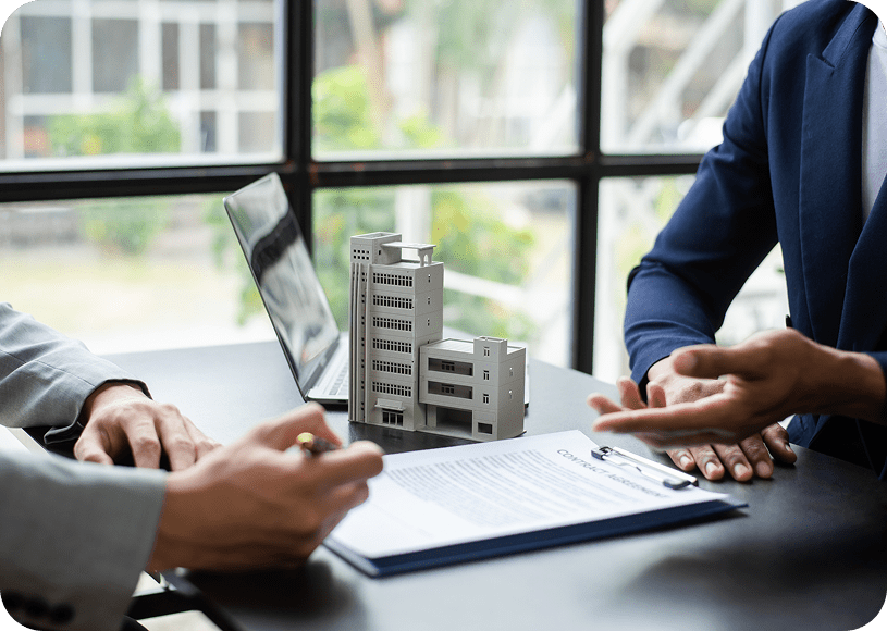 Business meeting with architectural model