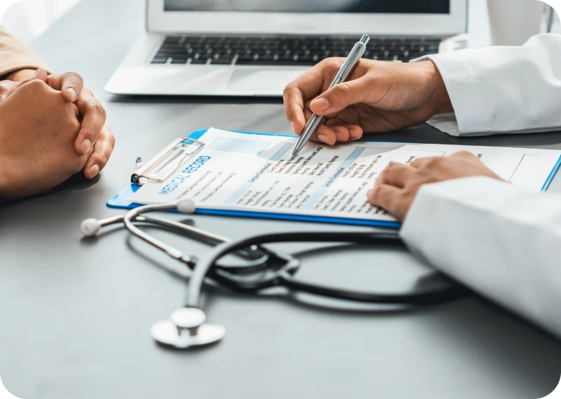 Doctor reviewing patient information on clipboard