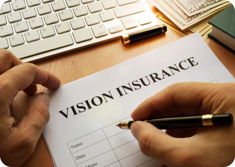 Person signing vision insurance form